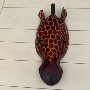 Hand crafted giraffe head in dark brown & tans. Made in Kenya.